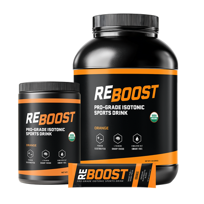 Two bottles of Orange (Electrolyte Powder) Reboost sports drink on a white background
